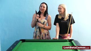 A big tits lesbian couple playing billiard and using the stick in a new way